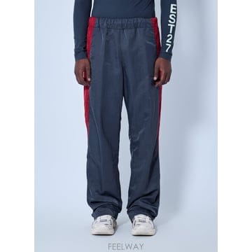 26 F/W 라코스테 런웨이 루즈 핏 스트라이프 디테일 조거팬츠 AG B0112330940